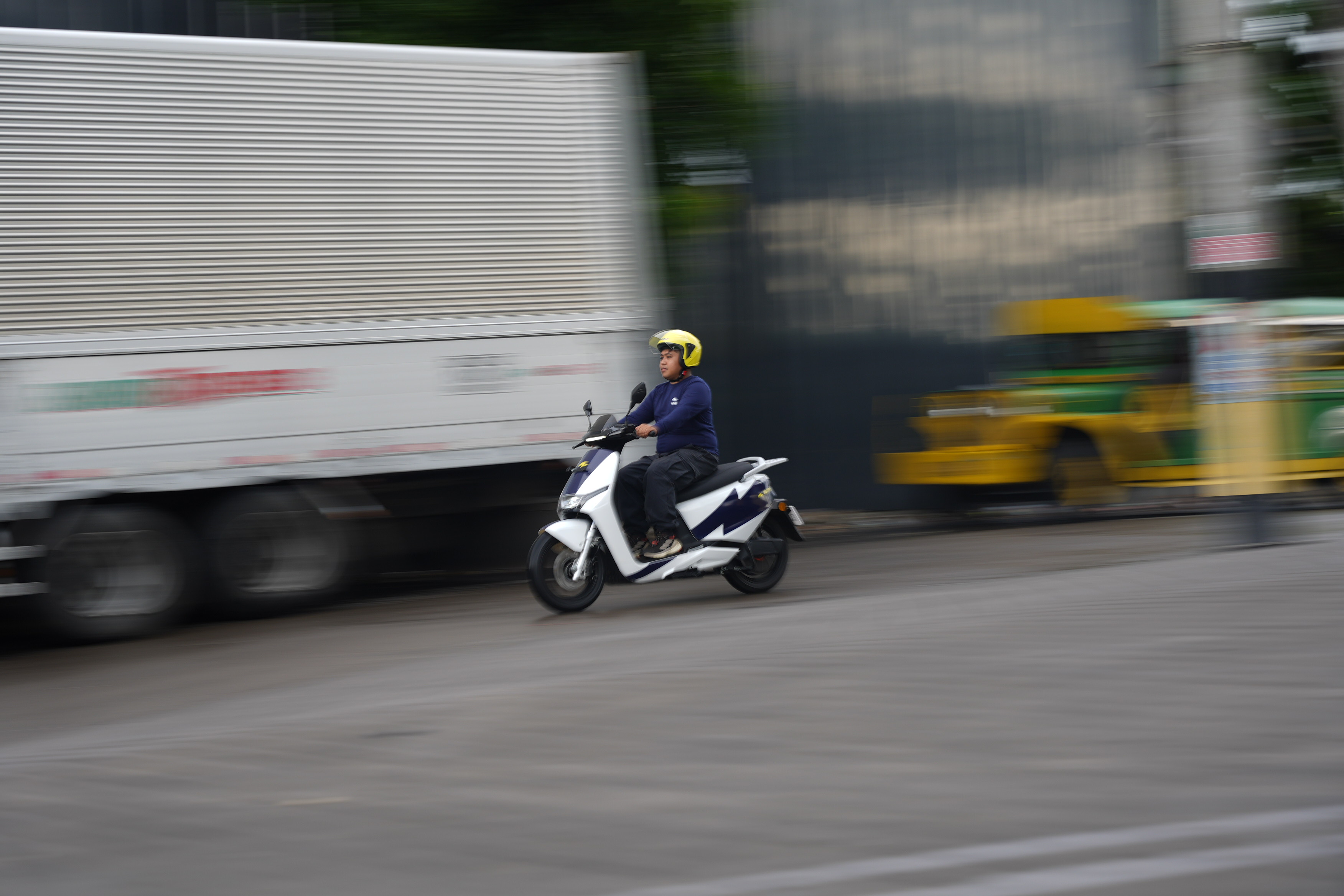 A Voltai electric motorcycle being ridden on the road